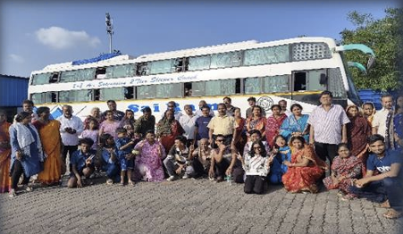 A large NP Service tour group beside their coach