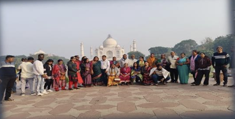An NP Service travel group in front of the Taj Mahal
