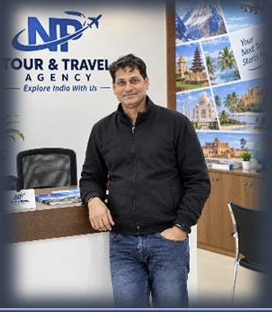 Inside the NP Service office, with the NP Tour & Travel Agency logo on the wall