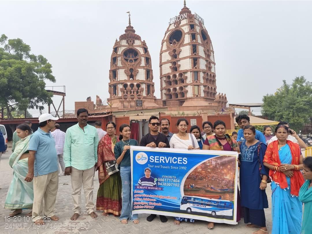 NP Service travellers with their banner in front of temple towers