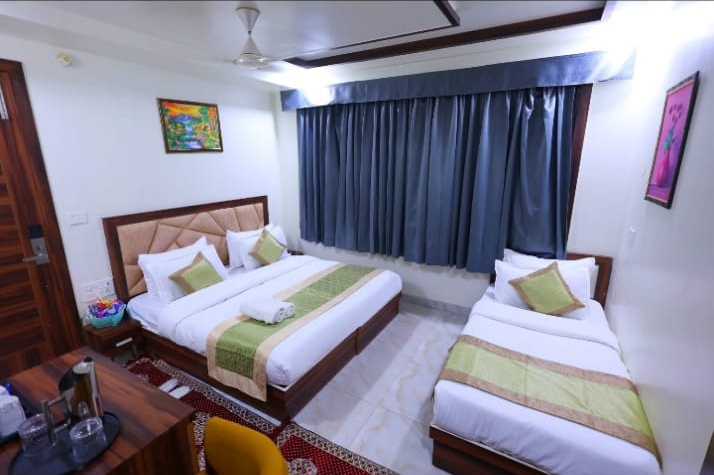 Guest room with neatly arranged beds and bedding