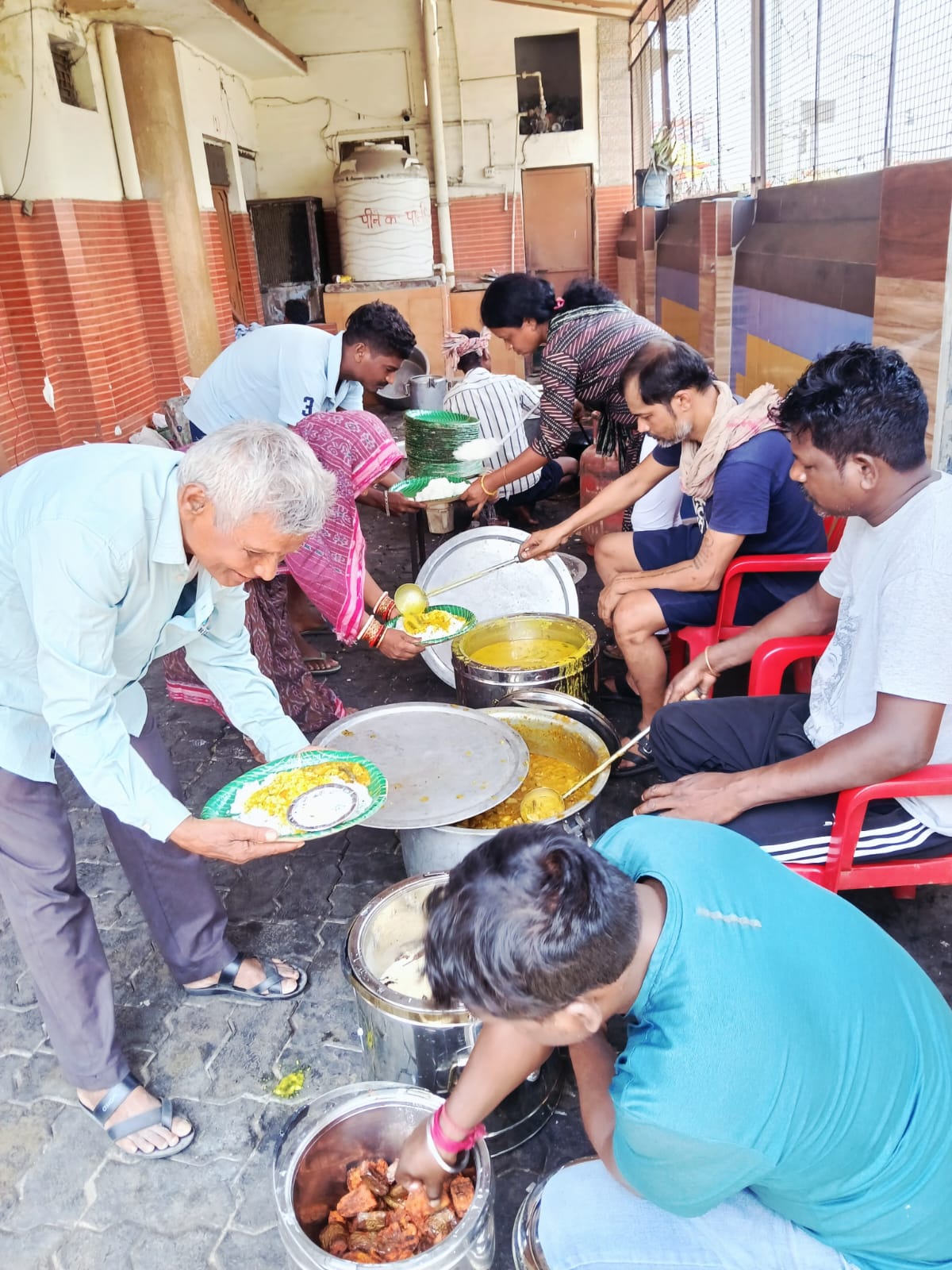 Travellers sharing a freshly served meal together