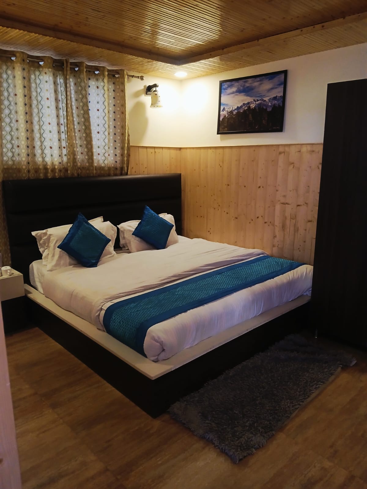 Guest room with neatly arranged beds and bedding